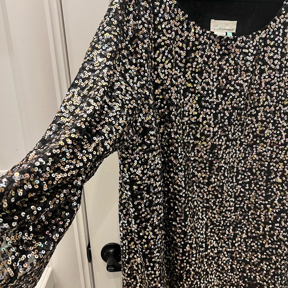 Multi colored short, 3/4 asymmetrical sleeve, sequin dress from Anthropologie 3x